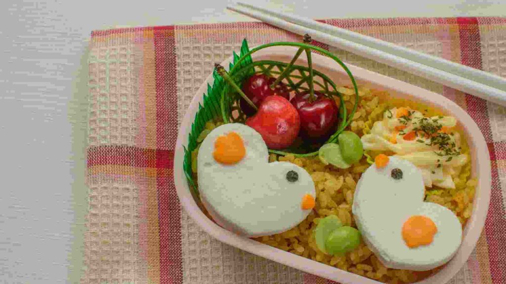 Bento or lunch boxes that have creative cutouts of foof may help kids to eat more. 